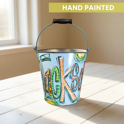 Personalized Easter Bucket Hand Painted Metal Pail Blue Name Boy Easter Celebration Custom Design Durable Container Toddler Gift Idea Candy Collection Basket Egg Hunt Helper Storage Solution Keepsake Item Special Holiday Tradition Easter